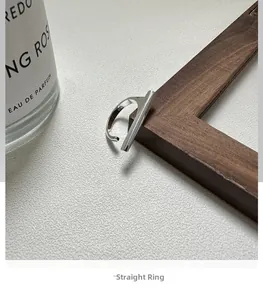 Macro shot of minimalist S925 sterling silver bar ring with material stamp detail