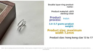 Detailed close-up showing the twisted rope texture and smooth silver bands of the ring