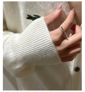 Minimalist S925 sterling silver bar ring shown worn against a white knit background