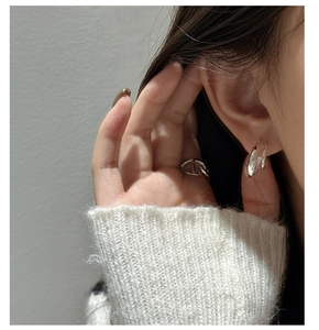 Detail showing S925 sterling silver curved double earrings and anchor link ring