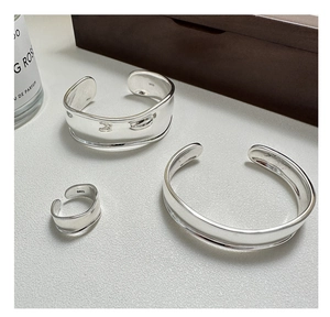 Close-up of S925 sterling silver hallmark on the polished inner band of the curved ring