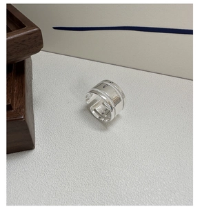 Detailed close-up of S925 sterling silver ring showing hallmark and engraved texture
