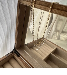 Detailed view of S925 sterling silver square link chains in gold and silver finishes