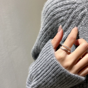 Minimalist double layer S925 sterling silver twist ring worn on finger