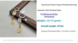 Macro shot of S925 silver Tang Grass earrings with gold-toned rectangular plate pendant
