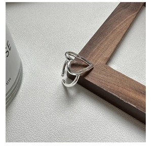 Close-up of S925 sterling silver hollow heart ring showing the engraved S925 hallmark