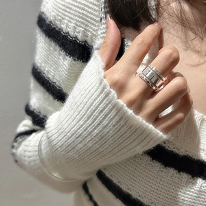 Polished S925 sterling silver triple-layer open ring shown on model finger