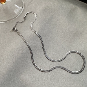 Minimalist S925 sterling silver flat snake bone necklace with wavy texture on grey leather