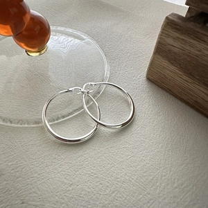 Minimalist S925 sterling silver hoop earrings with a polished finish and secure clasp