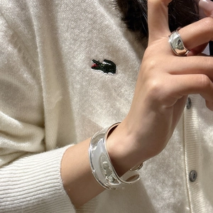 Minimalist wide S925 sterling silver cuff bracelet and matching ring on model