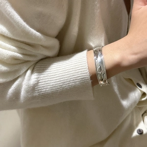 Polished S925 sterling silver wide cuff bracelet with irregular minimalist curved design