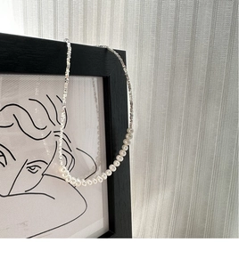 Detail of S925 sterling silver necklace featuring elegant pearls and shiny silver beads
