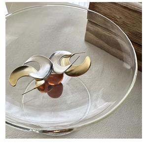 Detail of matte brushed S925 sterling silver crescent earrings in gold and silver