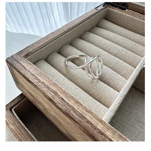 Macro shot of S925 sterling silver multi-layered crisscross ring in a vintage wooden box