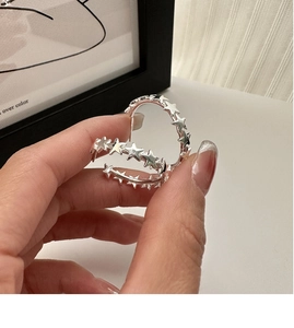 Detailed view of S925 silver pentagram earrings with a unique hollowed-out C-shaped design