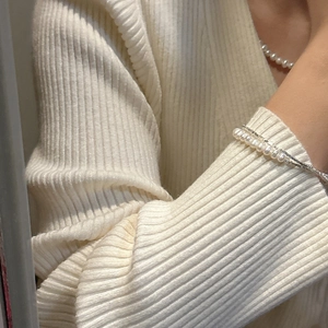 Minimalist S925 silver pearl layered necklace and bracelet set shown on a knit sweater