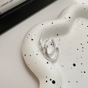 Minimalist S925 sterling silver C-shaped hoop earrings with a matte brushed texture finish