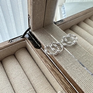 S925 sterling silver twist hoop earrings with minimalist beaded texture in a jewelry box