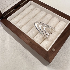 S925 sterling silver multi-layer V-shaped ring displayed in a premium wooden jewelry box