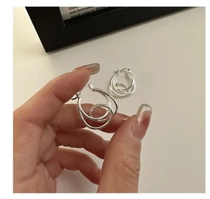 Detailed close-up of S925 sterling silver multi-layer intertwined knot hoop earrings