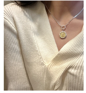 Detail of silver S925 necklace with gold coin pendant showing Elizabeth II relief portrait