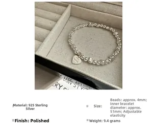 Close-up of S925 sterling silver beaded bracelet with heart pendant and BE MINE engraving