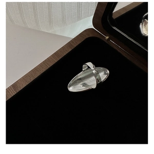 Detailed view of an adjustable S925 sterling silver shield ring in a premium wooden box