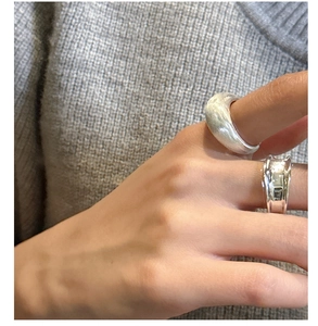 Detail of S925 sterling silver brushed ring set with matte and polished texture finishes