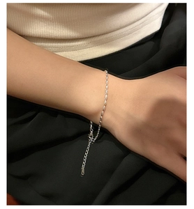 Macro detail of S925 sterling silver rice bead bracelet with lobster clasp and extender