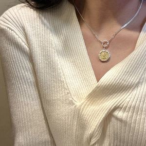 S925 sterling silver coin necklace featuring a Queen portrait pendant on a female model