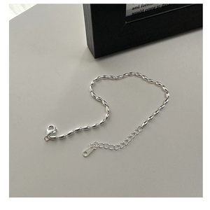 Close-up of S925 sterling silver bead bracelet showing lobster clasp and S925 stamp