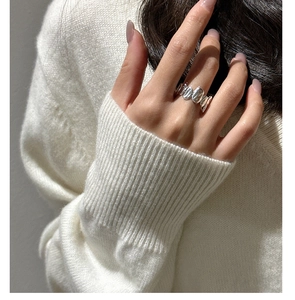 Detail of S925 sterling silver ring featuring unique liquid metal wavy texture on model