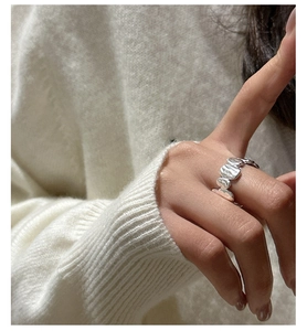 Close-up of S925 sterling silver ring with organic lava texture and liquid metal finish