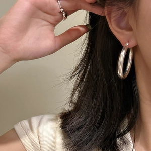 Minimalist S925 sterling silver large hoop earrings and simple ring worn by model