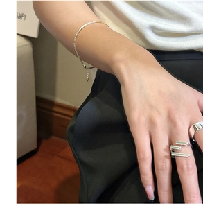 S925 sterling silver layered geometric ring and thick band worn by a model
