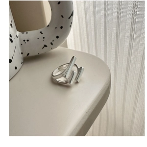 Close-up of minimalist S925 sterling silver multilayer ring with geometric design