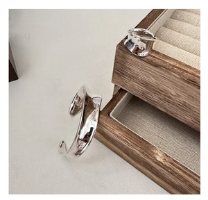 Detail of S925 sterling silver cuff and ring set showing liquid metal texture and hallmarks