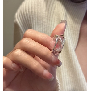 Close-up of a S925 sterling silver multilayer wrap ring worn on a finger