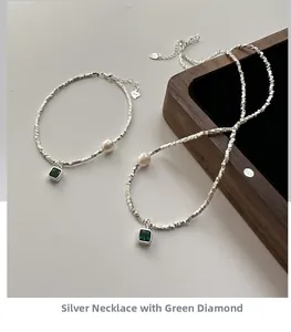 Detail of S925 silver irregular beads necklace set with green zircon and pearl