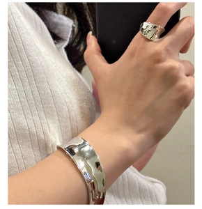 Detailed view of the S925 sterling silver lava texture open cuff and matching ring set