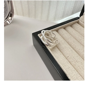 Close-up of S925 sterling silver multi-layer intertwined ring in a jewelry box