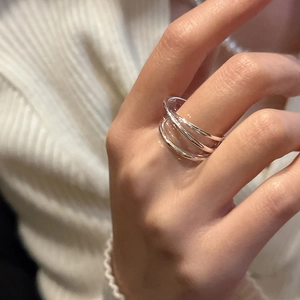Minimalist S925 sterling silver triple layered interlocking ring worn on a finger