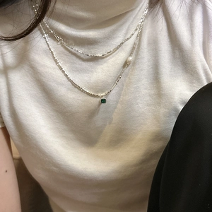 S925 sterling silver layered necklace with green zircon and pearl on white sweater