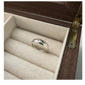 Close-up of 925 sterling silver star ring with zircons in a vintage jewelry box