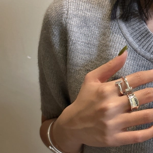 Minimalist S925 sterling silver T-shaped open ring and bracelet set worn by a model