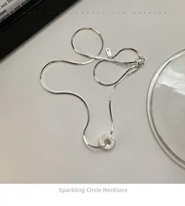 Detail shot of S925 sterling silver donut pendant with sparkling sand finish and clasp
