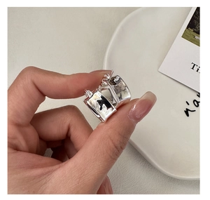 Detailed view of square pleated texture S925 sterling silver earrings with mirror polish
