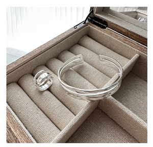Artistic silver textured open ring and bangle set inside a wooden jewelry box