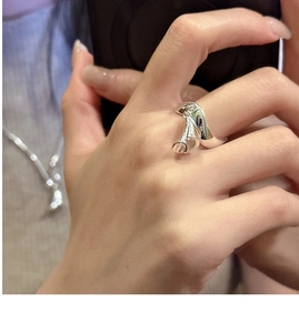 Detailed close-up of a silver Calla Lily flower shaped open ring on a finger