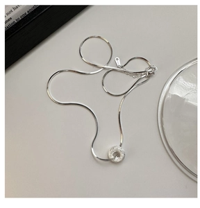 Detailed shot of S925 sterling silver snake chain and frosted donut ring pendant